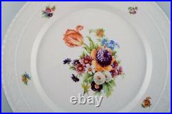 KPM, Berlin. Five antique porcelain plates with hand-painted flowers