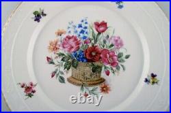 KPM, Berlin. Two antique porcelain plates with hand-painted flower baskets