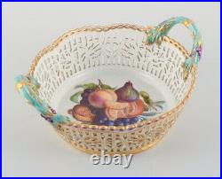 KPM, Germany. Large impressive and openwork bowl hand-painted with fruits
